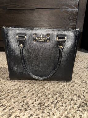 kate spade black pebbled leather satchel with gold plaque